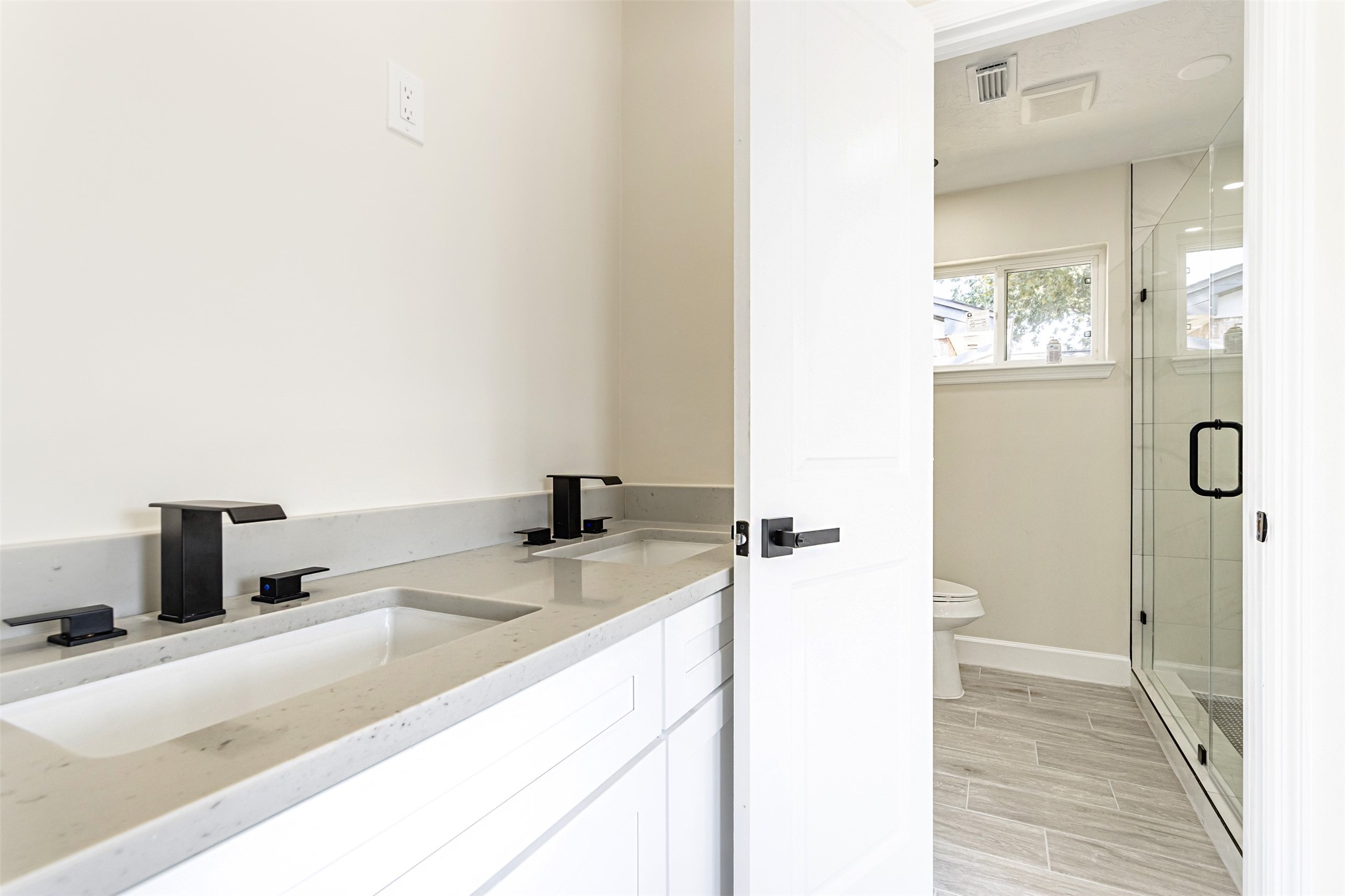 11203 Rousseau Drive Houston, TX 77065 - Photo 24 of 50 a bathroom with a granite countertop sink and a mirror