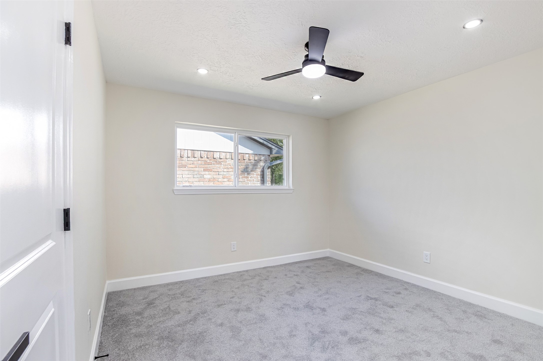 11203 Rousseau Drive Houston, TX 77065 - Photo 30 of 50 an empty room with a window