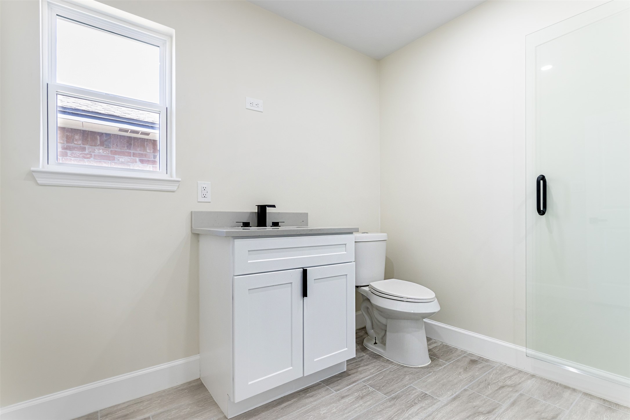 11203 Rousseau Drive Houston, TX 77065 - Photo 32 of 50 a bathroom with a toilet and a sink