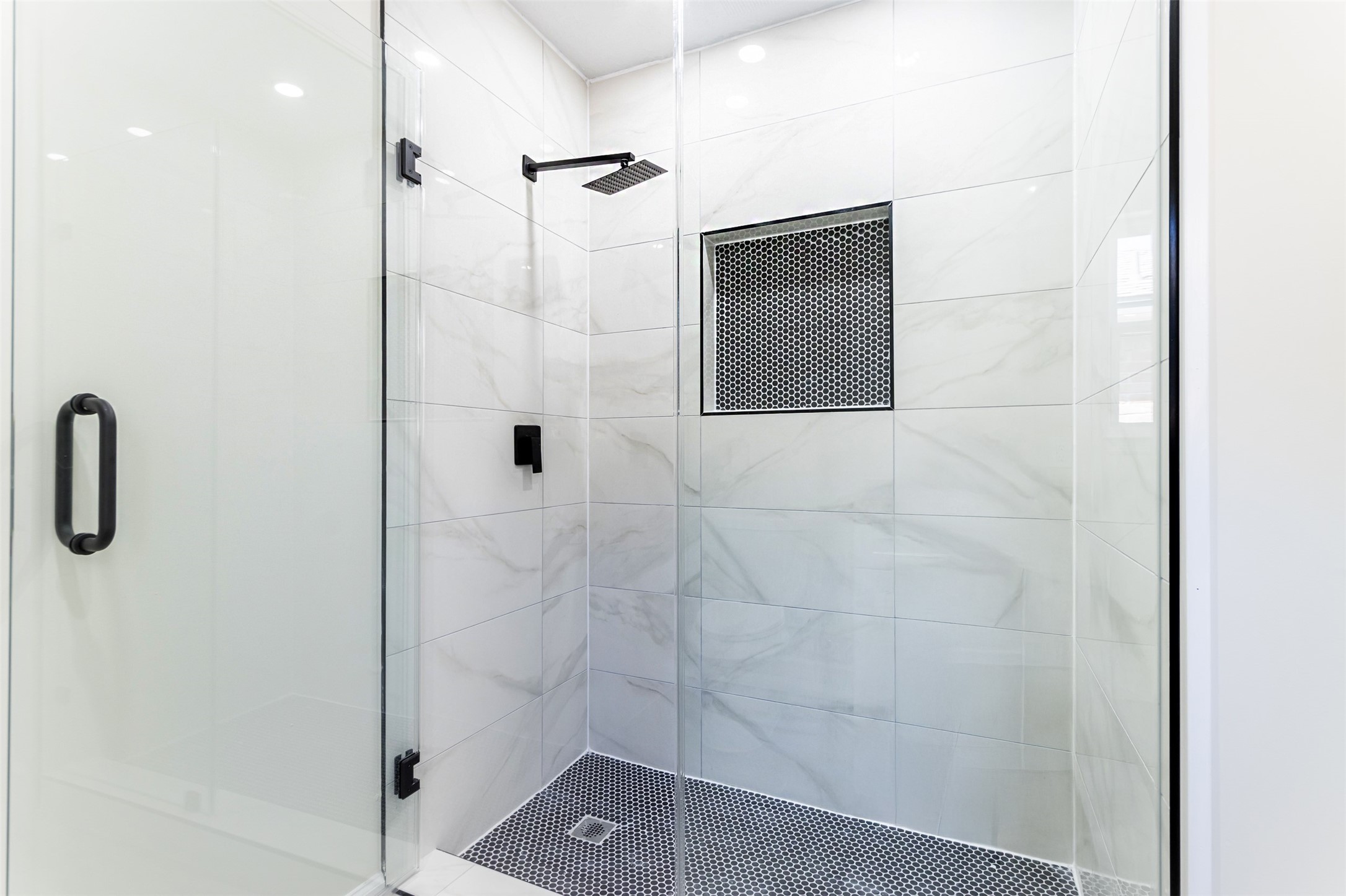 11203 Rousseau Drive Houston, TX 77065 - Photo 34 of 50 a bathroom with a shower and a mirror