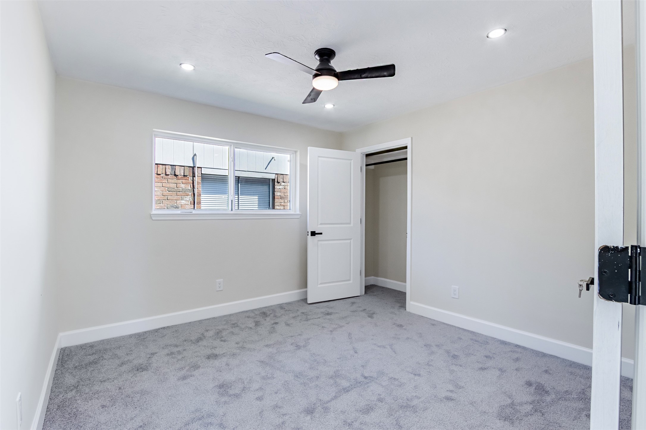 11203 Rousseau Drive Houston, TX 77065 - Photo 35 of 50 an empty room with ceiling fan and windows