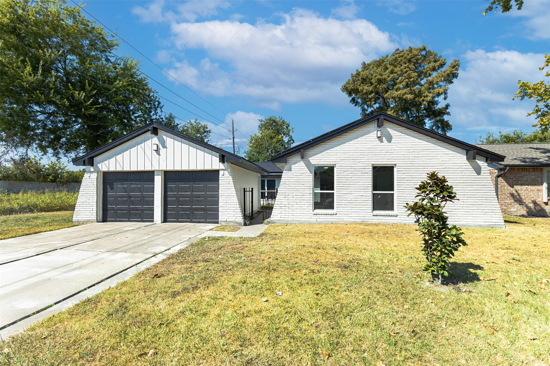11203 Rousseau Drive Houston, TX 77065 - Photo 39 of 50 a front view of a house with a yard and garage