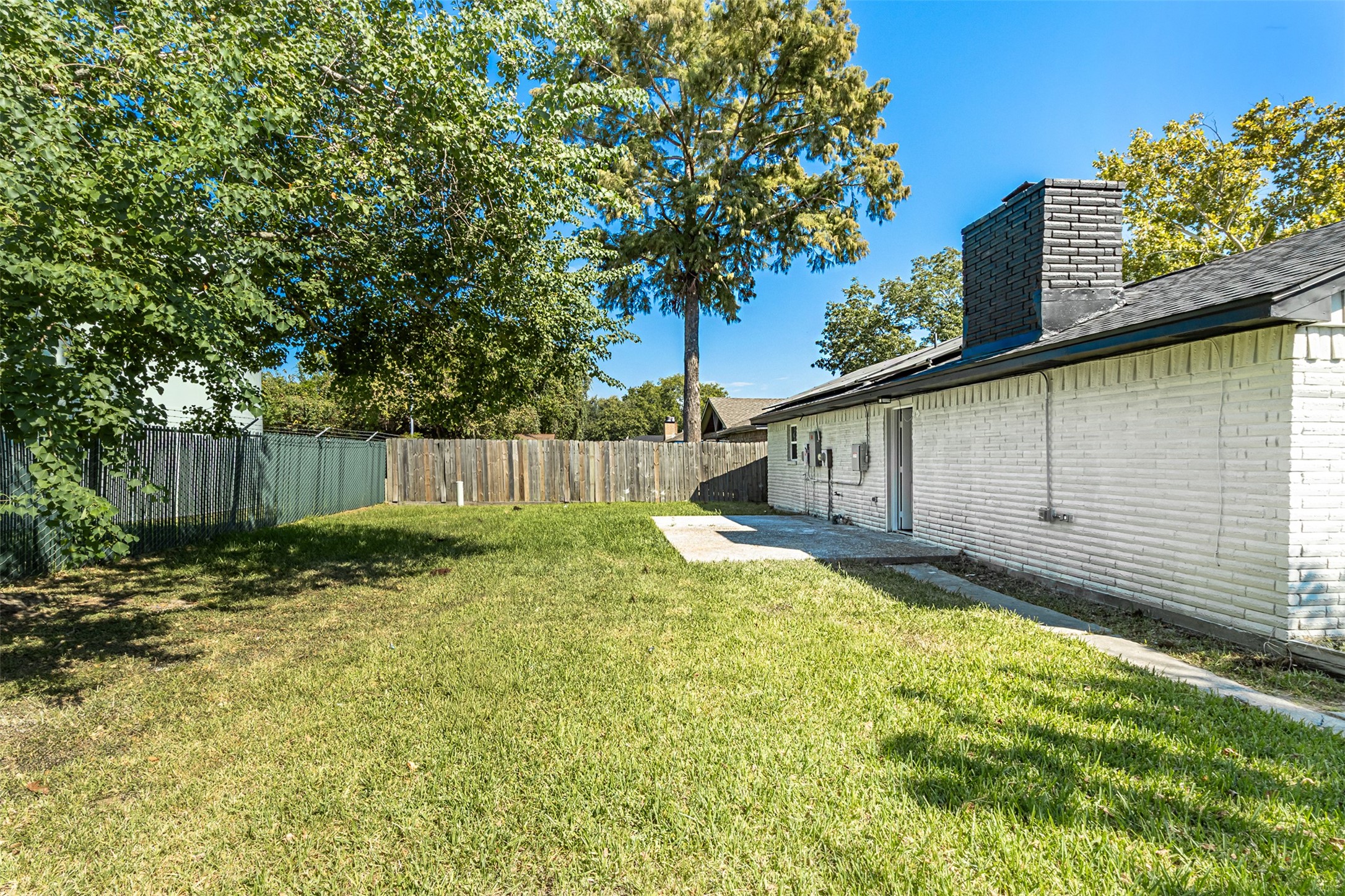 11203 Rousseau Drive Houston, TX 77065 - Photo 43 of 50 a backyard of a house with table and chairs