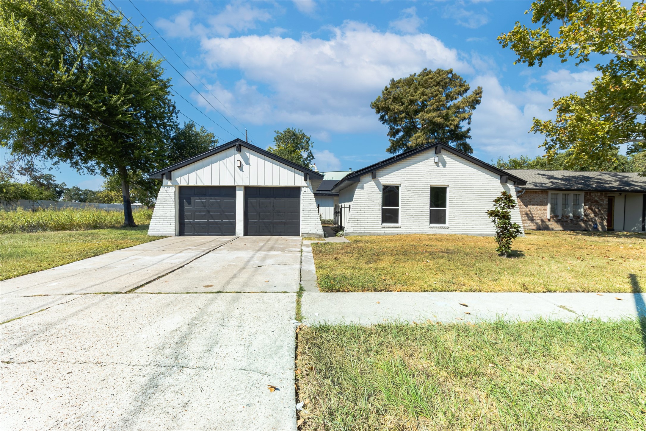 11203 Rousseau Drive Houston, TX 77065 - Photo 5 of 50 a front view of a house with a yard