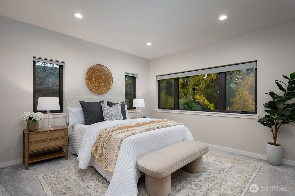 4815 Evanston Avenue North, Unit B Seattle, WA 98103 - Photo 18 of 37 a bedroom with bed and a window