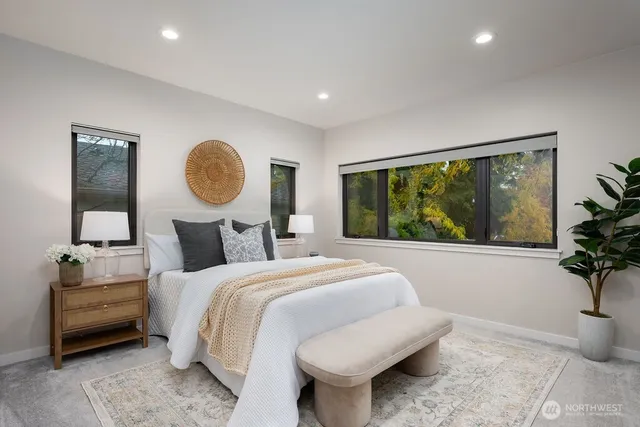 a bedroom with bed and a window