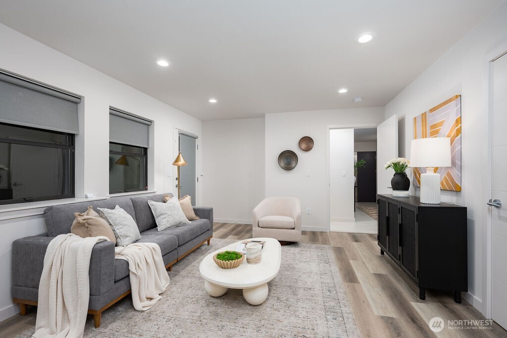 4815 Evanston Avenue North, Unit B Seattle, WA 98103 - Photo 25 of 37 a living room with furniture and a flat screen tv