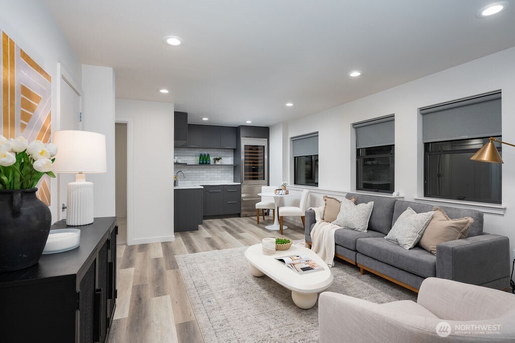 4815 Evanston Avenue North, Unit B Seattle, WA 98103 - Photo 26 of 37 a living room with furniture and a couch
