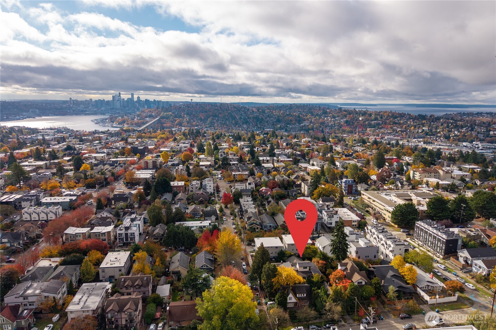 4815 Evanston Avenue North, Unit B Seattle, WA 98103 - Photo 3 of 37 an aerial view of a house with yard and mountain view in all around