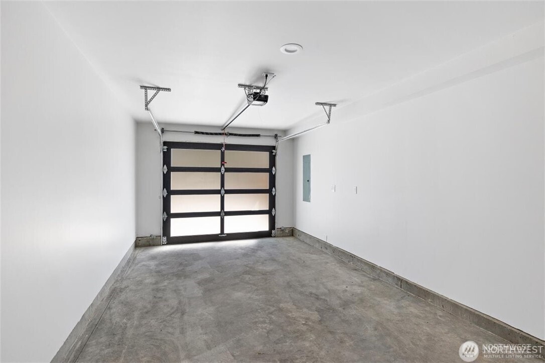 4815 Evanston Avenue North, Unit B Seattle, WA 98103 - Photo 35 of 37 a view of empty room with a windows