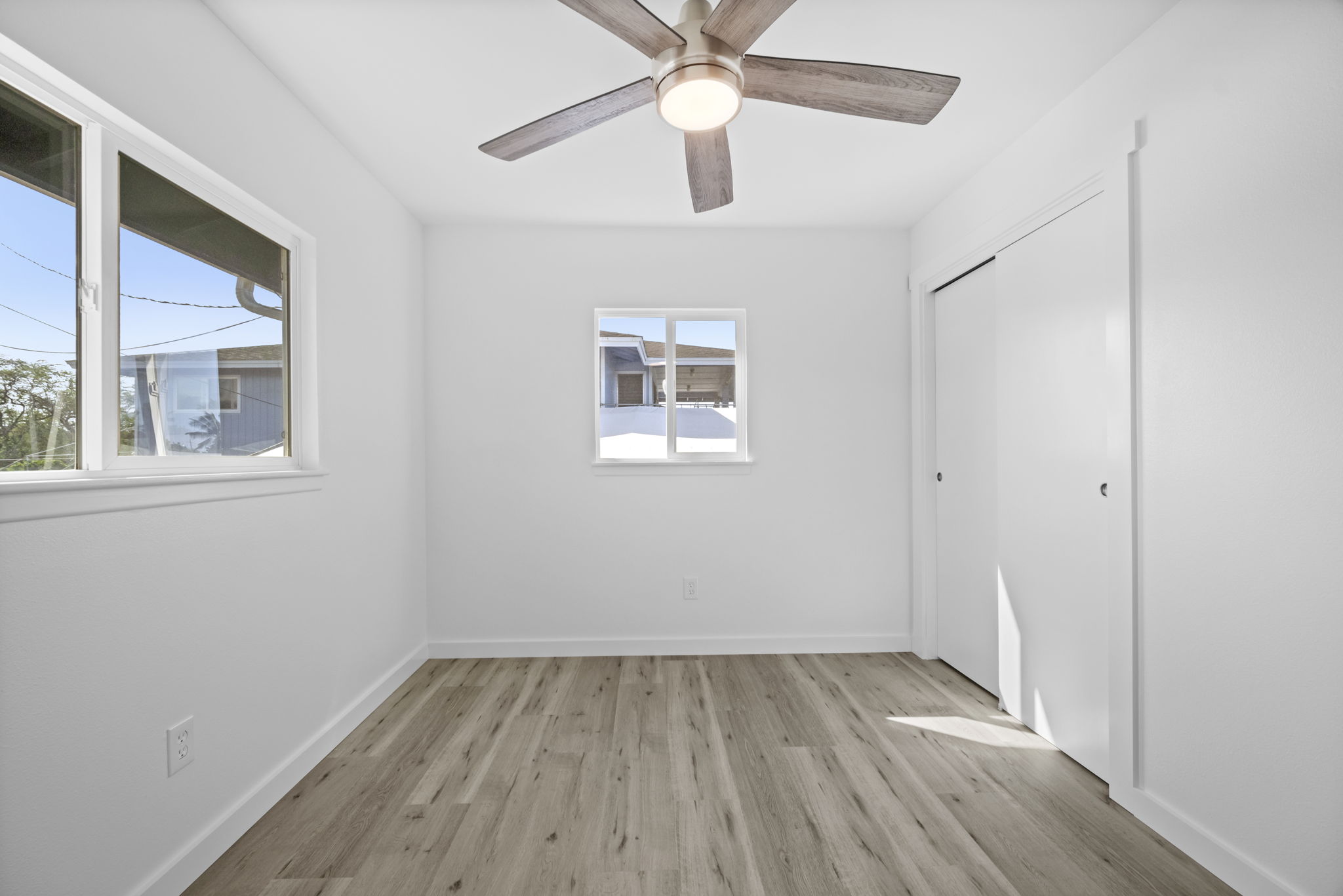 4431 Iona Road Hanapepe, HI 96705 - Photo 14 of 20 an empty room with a window and wooden floor