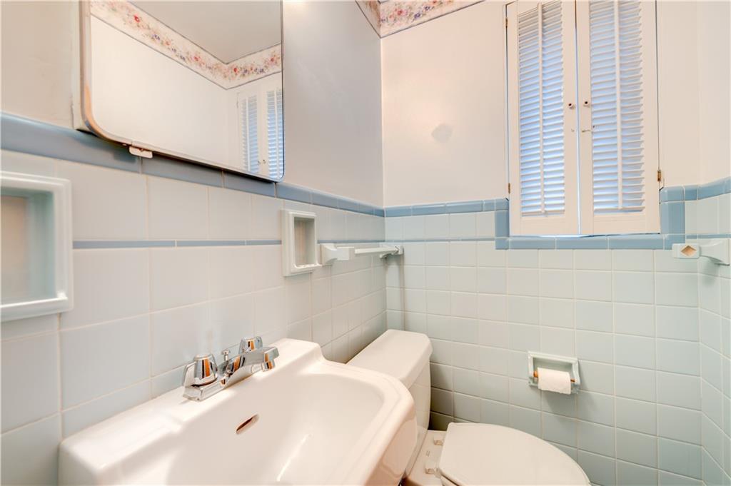 271 Newburn Drive Mt. Lebanon, PA 15216 - Photo 4 of 24 a bathroom with a sink a toilet and mirror