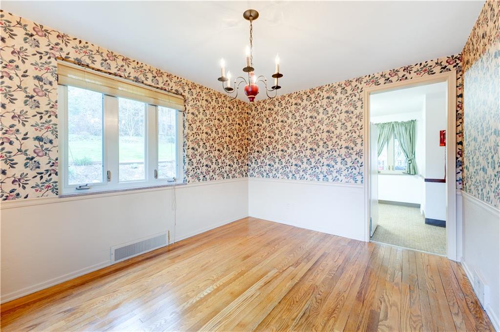 271 Newburn Drive Mt. Lebanon, PA 15216 - Photo 6 of 24 wooden floor in an empty room with a window