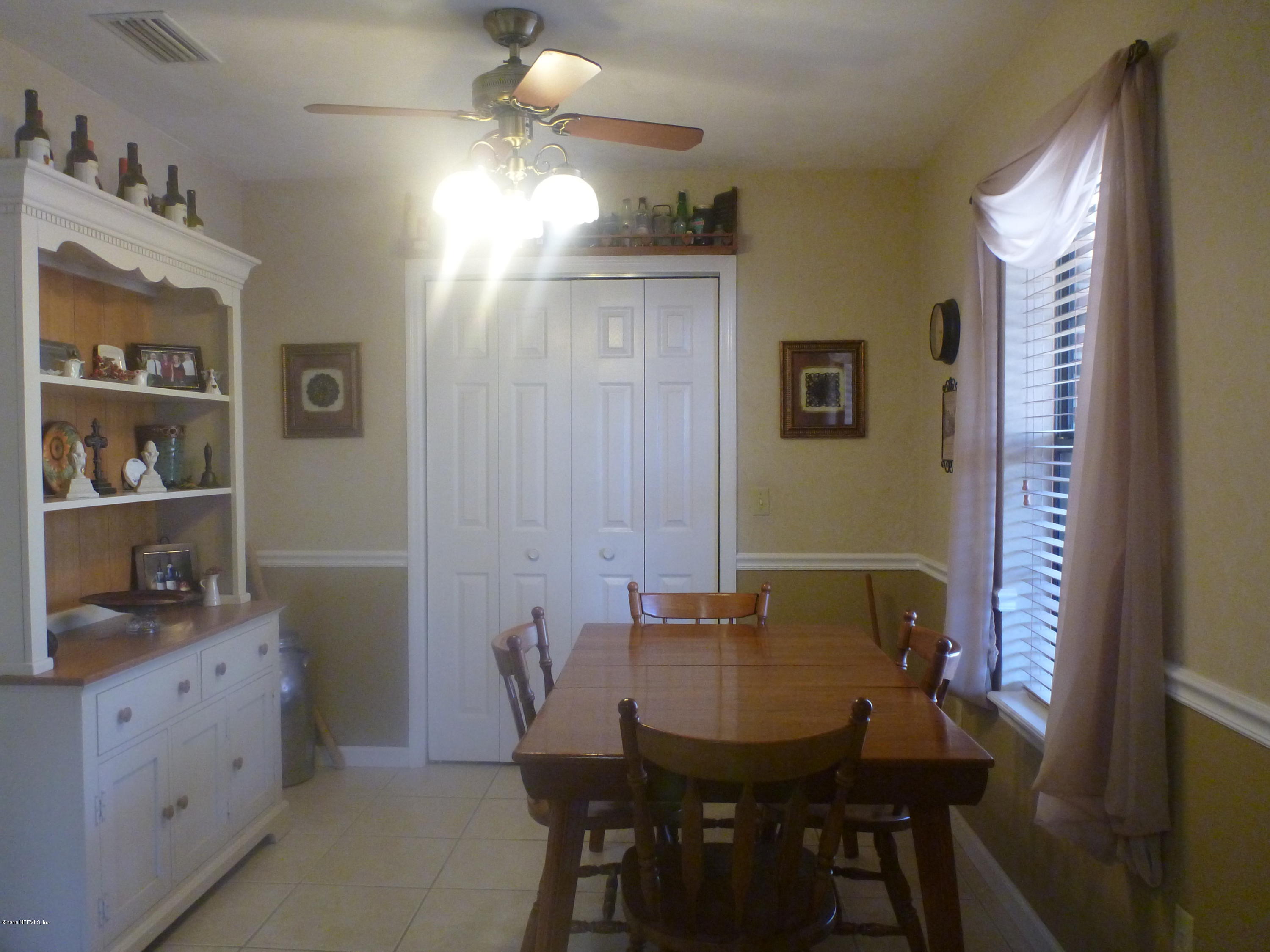 6285 Payne Road Keystone Heights, FL 32656 - Photo 19 of 31 a view of a dining room with furniture