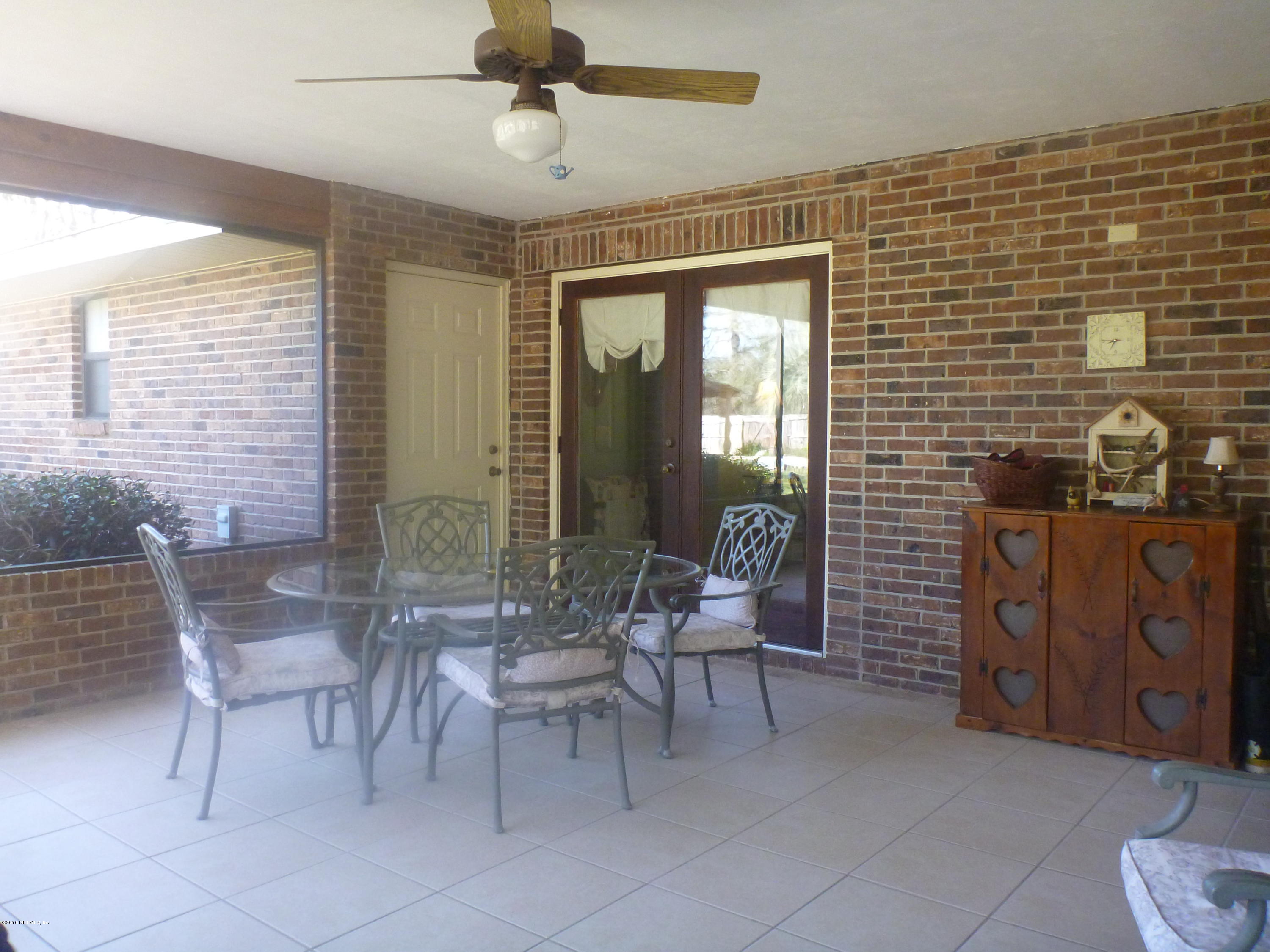 6285 Payne Road Keystone Heights, FL 32656 - Photo 24 of 31 a dining room with furniture and wooden floor