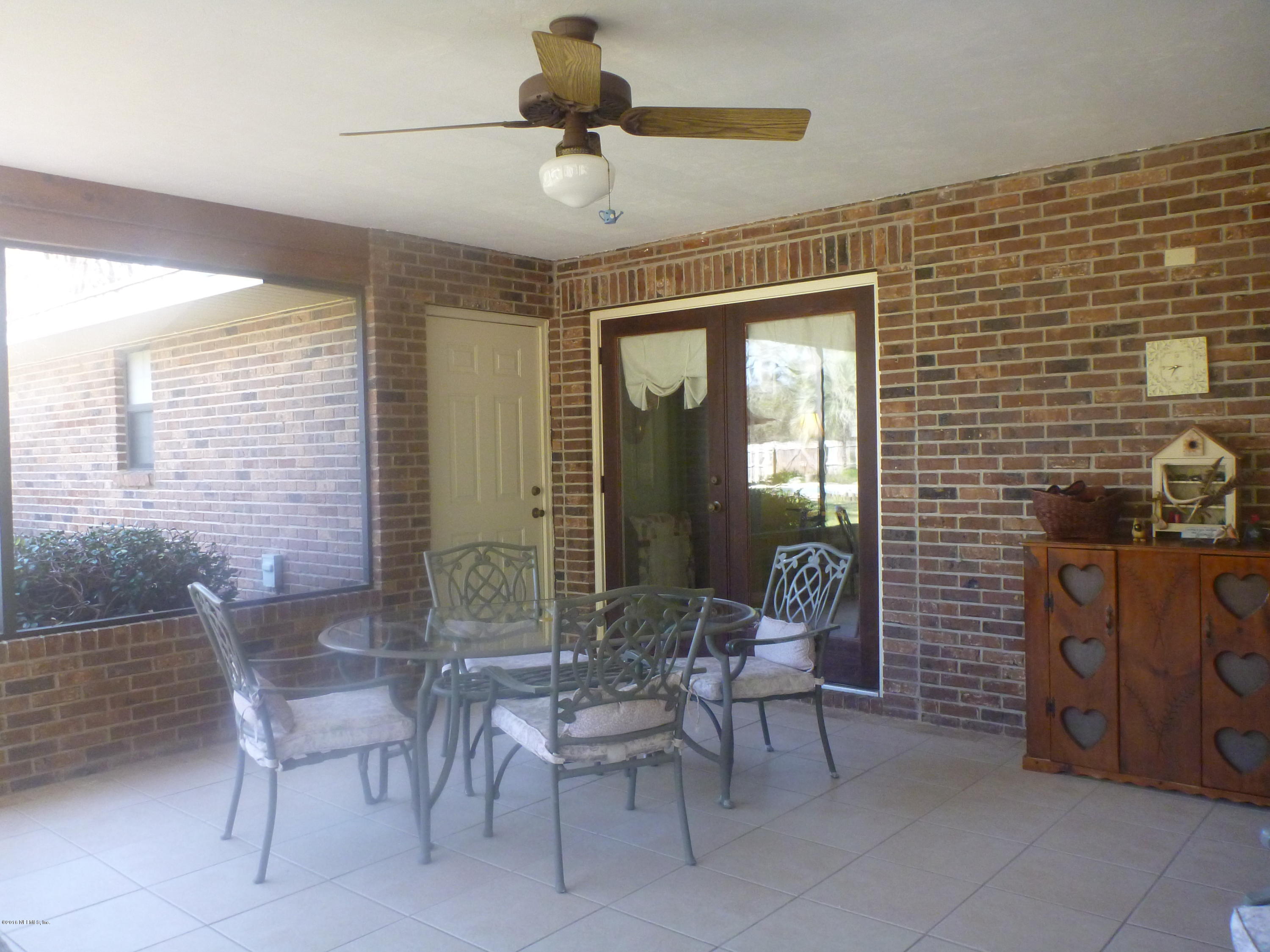 6285 Payne Road Keystone Heights, FL 32656 - Photo 25 of 31 a dining room with furniture and window