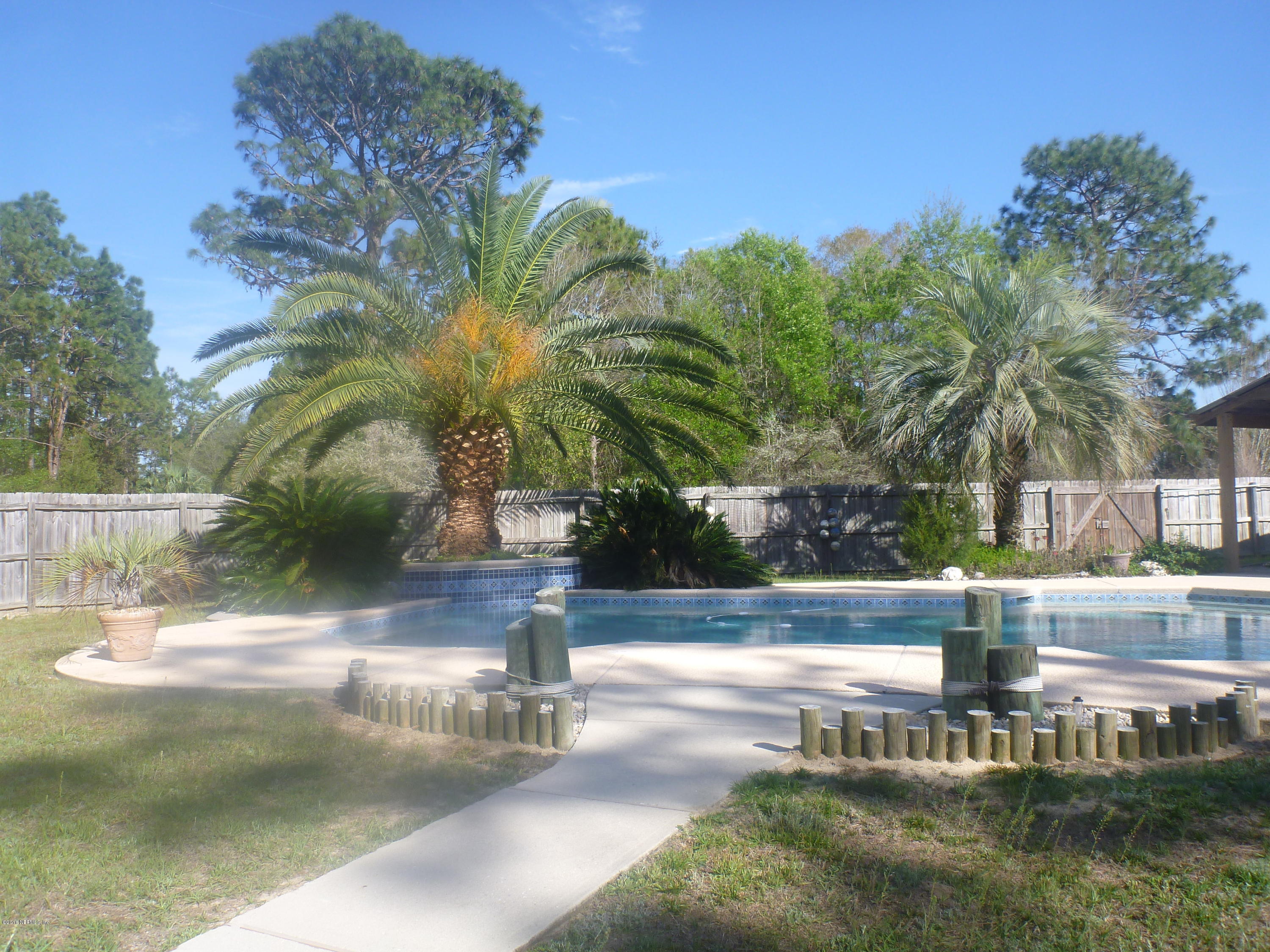 6285 Payne Road Keystone Heights, FL 32656 - Photo 30 of 31 a view of a swimming pool with a yard