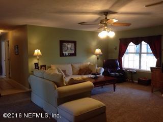 6285 Payne Road Keystone Heights, FL 32656 - Photo 3 of 31 a living room with furniture and a large window