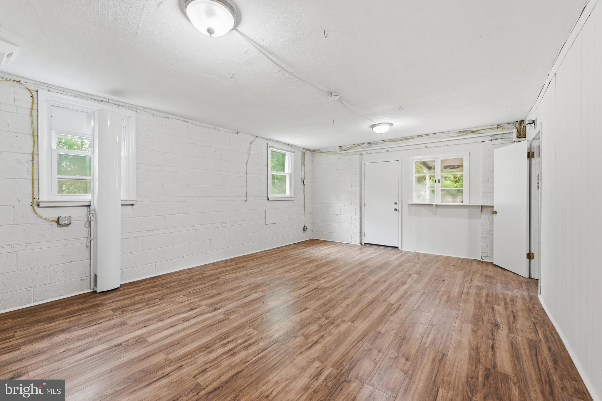 228 Northwest Terrace Silver Spring, MD 20901 - Photo 48 of 70 a view of empty room with wooden floor and fan