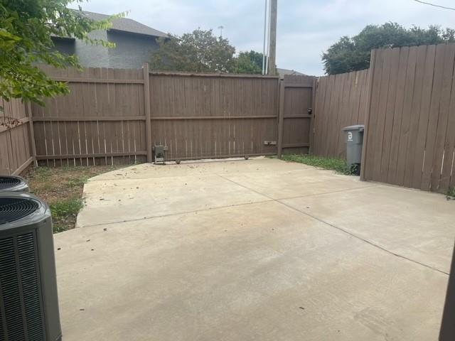 9495 Timberleaf Drive Dallas, TX 75243 - Photo 9 of 11 View of patio / terrace with central AC unit