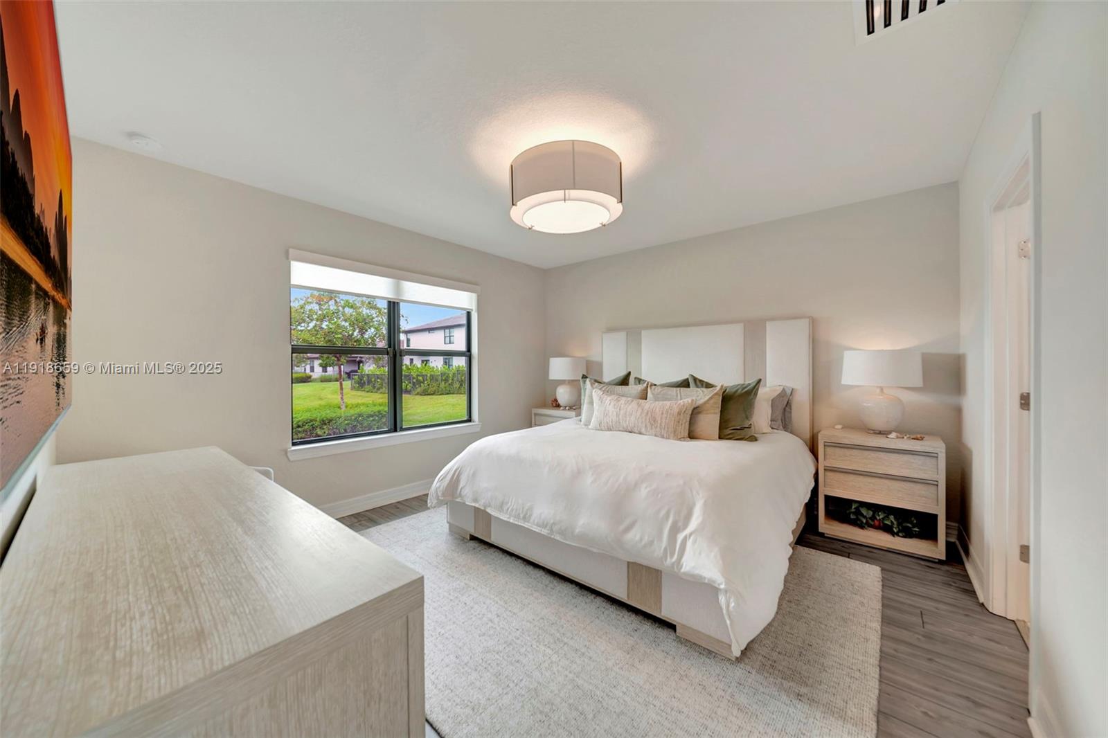 2941 Shortleaf Avenue Lauderdale Lakes, FL 33311 - Photo 11 of 47 a spacious bedroom with a bed and a large window