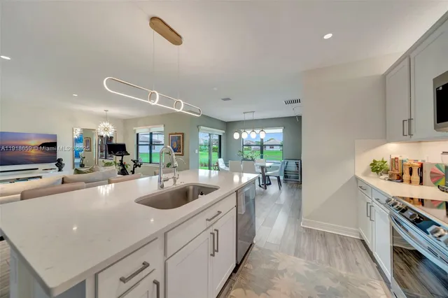 a kitchen with sink and stove