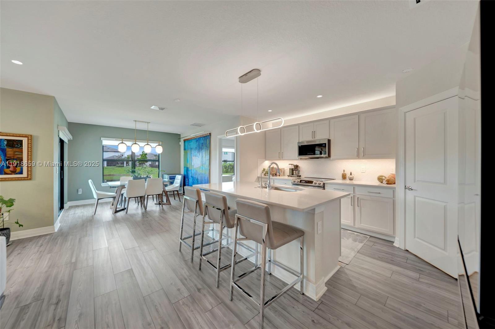 2941 Shortleaf Avenue Lauderdale Lakes, FL 33311 - Photo 22 of 47 a view of a dining room with furniture window and wooden floor