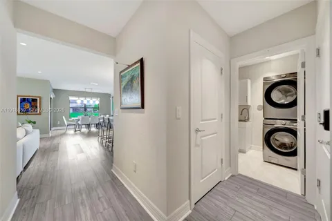 a view of a hallway with washer and dryer