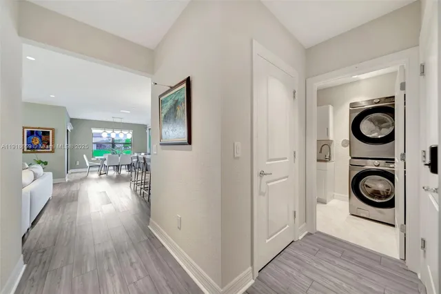 a view of a hallway with washer and dryer