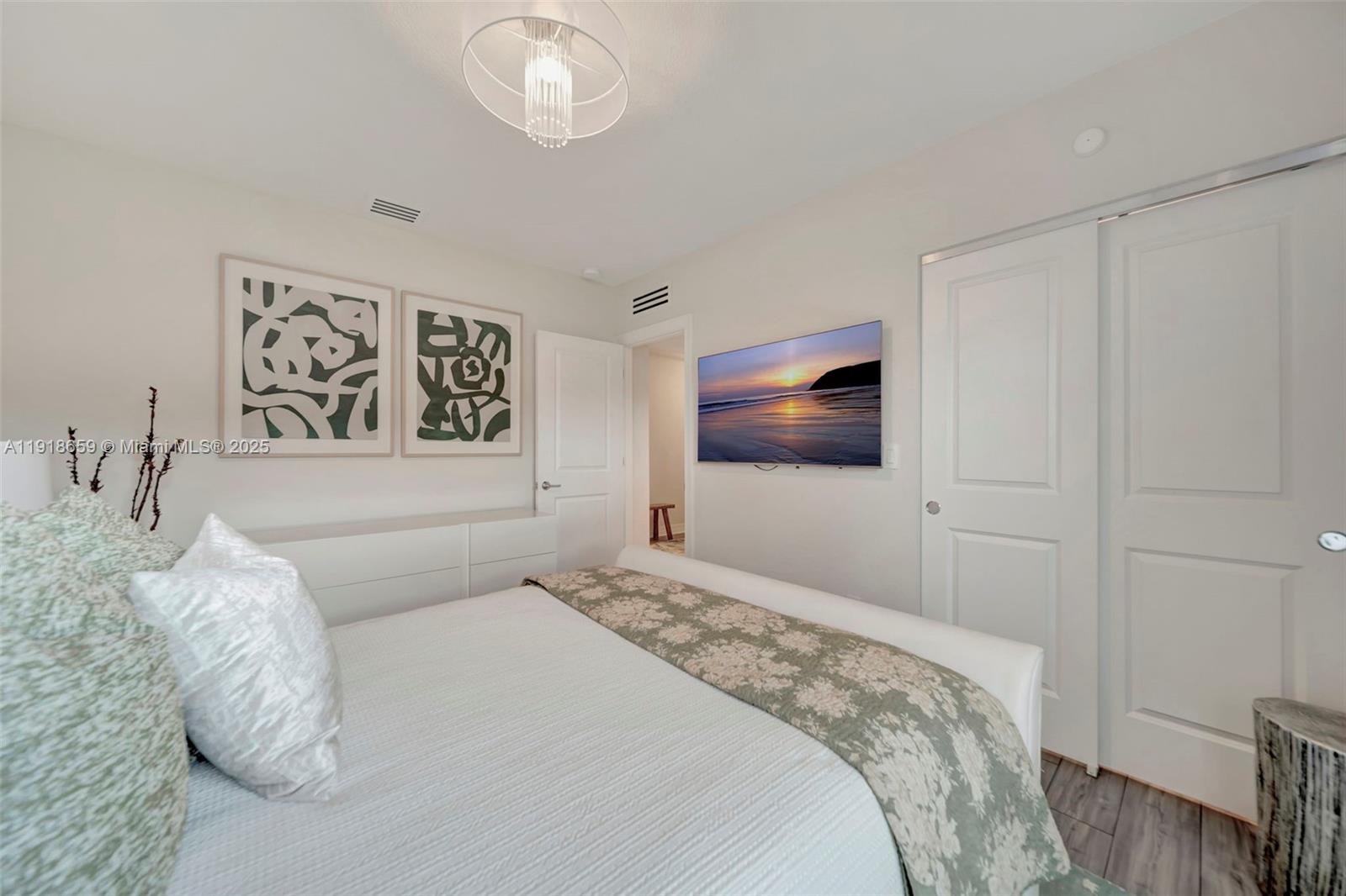 2941 Shortleaf Avenue Lauderdale Lakes, FL 33311 - Photo 32 of 47 a bedroom with a large bed and a flat screen tv