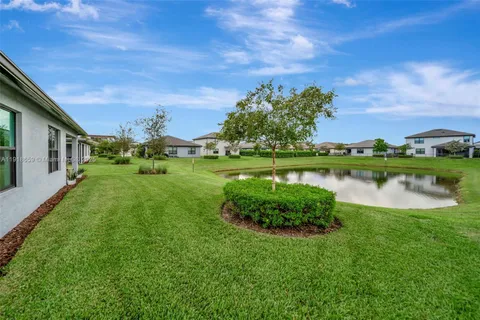 a view of a lake with a house in the background