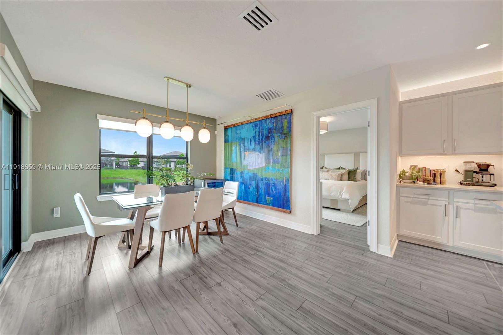 2941 Shortleaf Avenue Lauderdale Lakes, FL 33311 - Photo 7 of 47 a dining room with furniture a rug and wooden floor