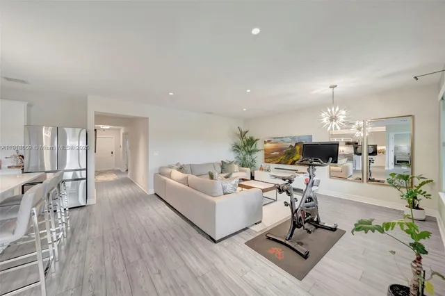 a view of a livingroom with furniture and a table