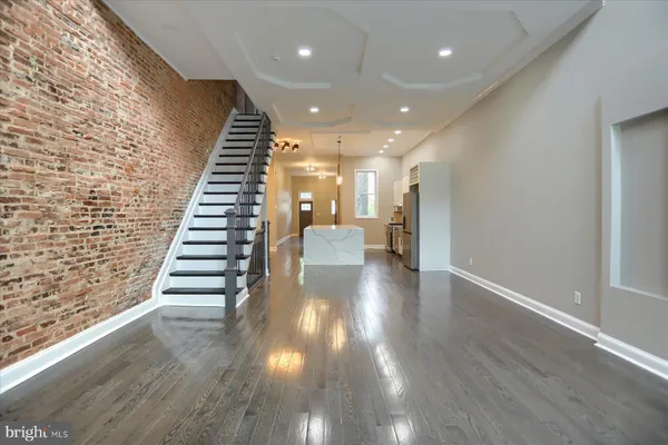 a view of an entryway with wooden floor
