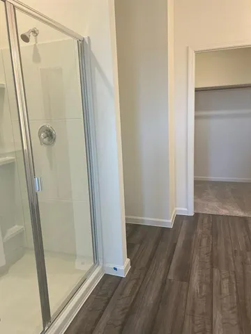 a view of bathroom with wooden floor