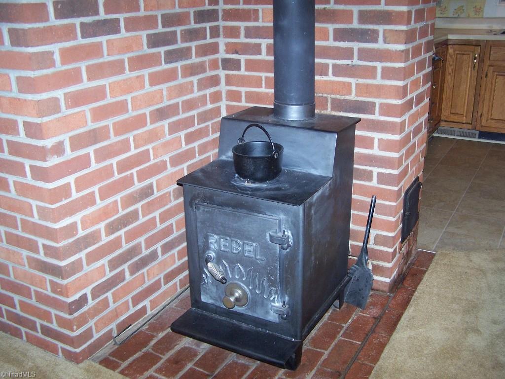 1310 Pebblebrook Road Winston-Salem, NC 27105 - Photo 12 of 25 Cozy wood stove