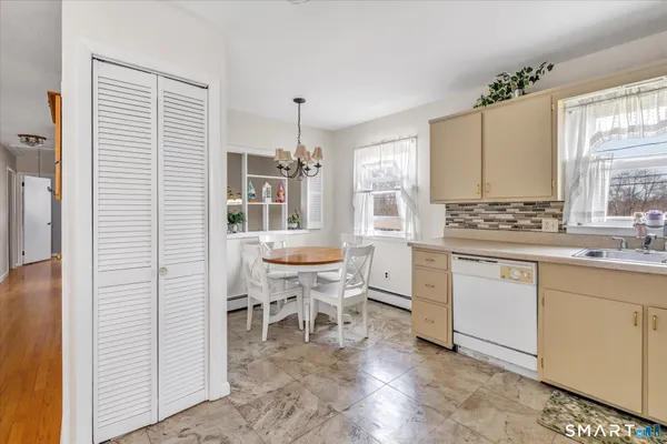 a view of a dining room with furniture window and outside view
