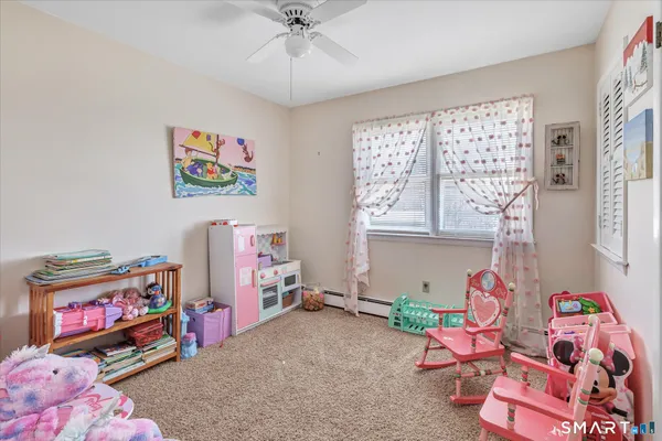 a bedroom with furniture and a window