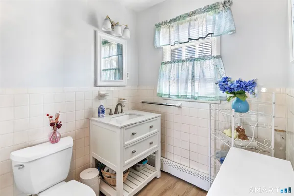 a dining room with furniture and a floor to ceiling window