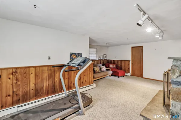 a white toilet sitting next to a bathroom sink