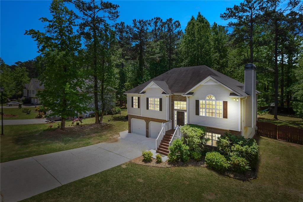 187 Enclave Drive Powder Springs, GA 30127 - Photo 1 of 1 Beautiful night time view of home with large level lot and long driveway.
