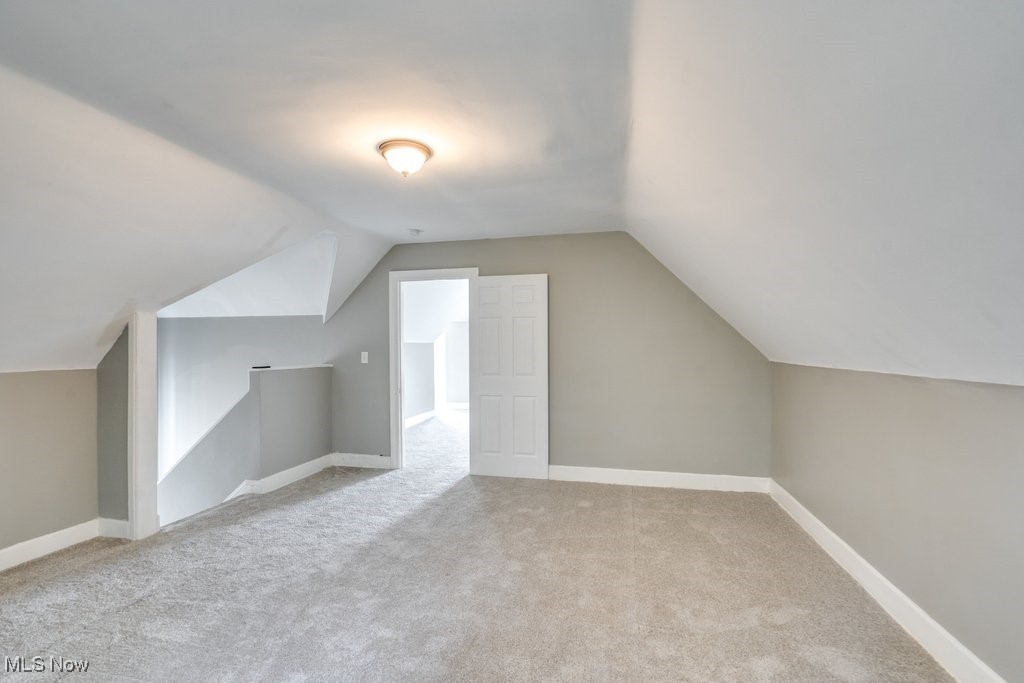 1261 Rozelle Avenue Cleveland, OH 44112 - Photo 28 of 32 Bonus room with vaulted ceiling and carpet floors