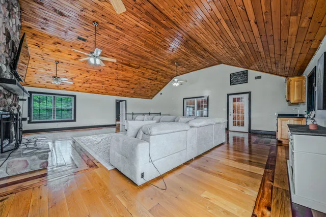 a view of living room kitchen with furniture and flat screen tv