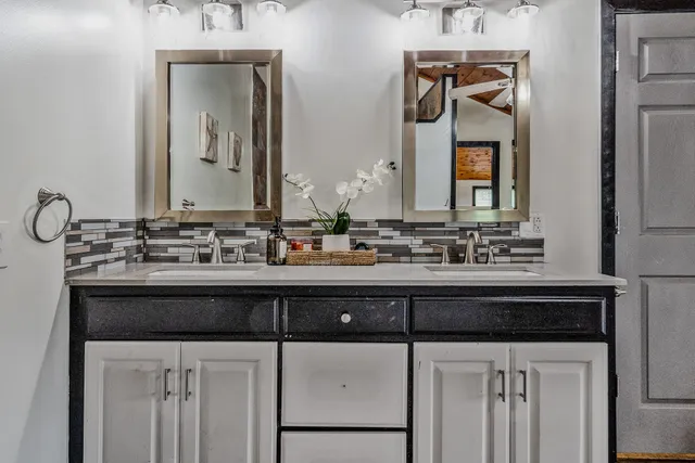 a bathroom with a sink and a mirror