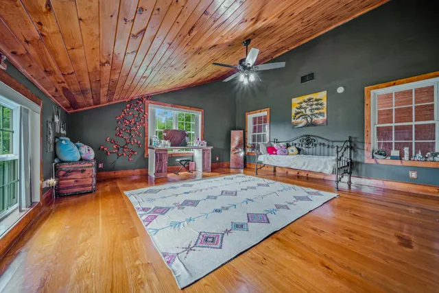a view of a livingroom with furniture and staircase