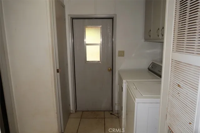 a view of a room with wooden floor and a sink