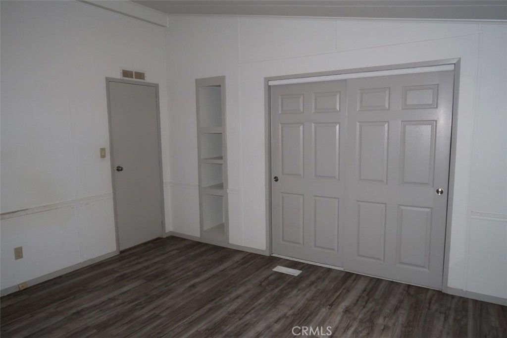 19138 New York Flat Road Forbestown, CA 95941 - Photo 25 of 37 a view of an empty room with wooden floor and closet