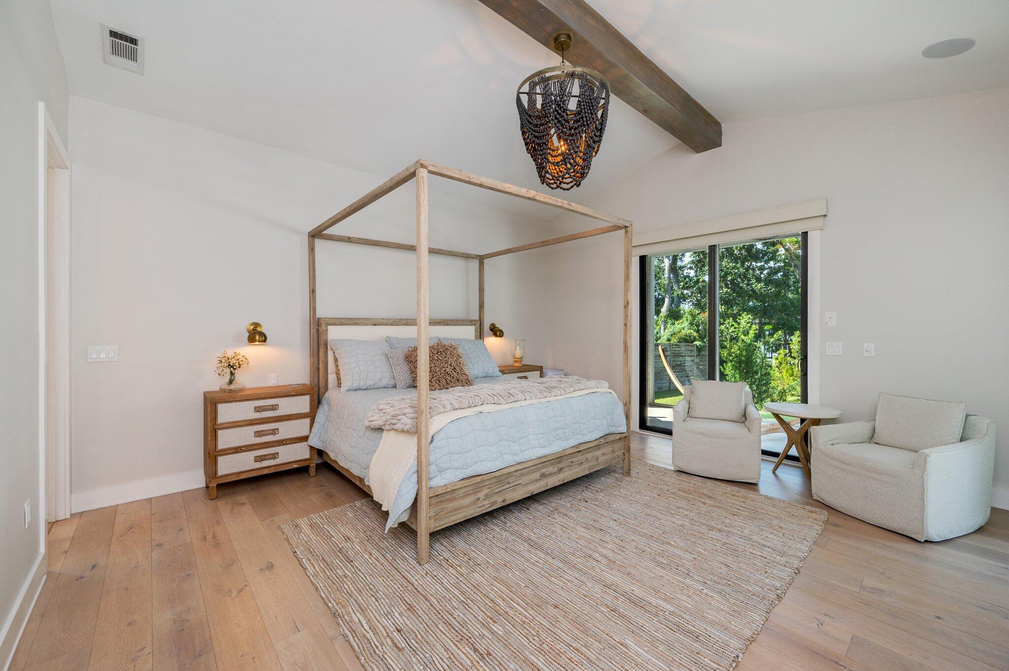 164 Bay Trace Santa Rosa Beach, FL 32459 - Photo 28 of 90 a bedroom with a bed and wooden floor