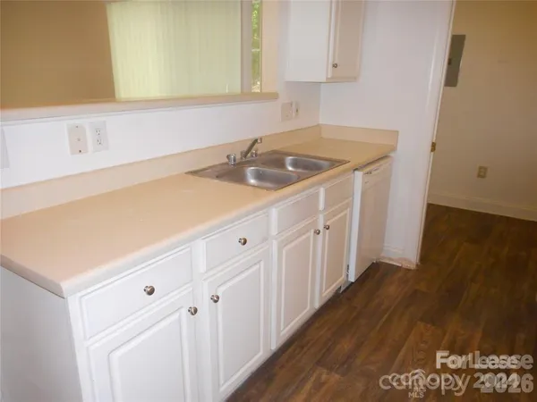 a kitchen with a sink and cabinets