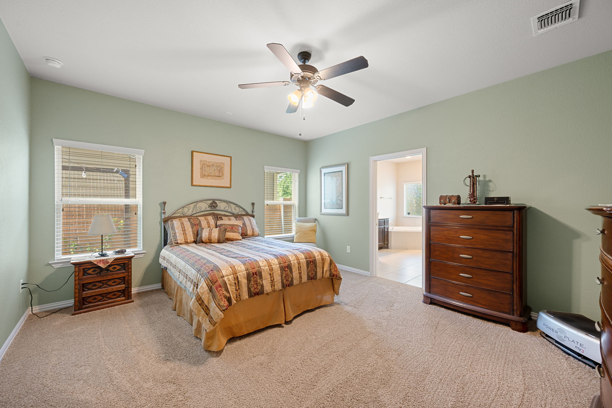 8800 Slater Drive Austin, TX 78747 - Photo 16 of 40 a bedroom with a bed and a dresser